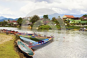 Boats by the Song River in Vang Vieng, Laos