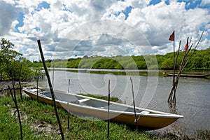 Boats stopped on the Jaguaripe river in Maragogipinho, district of the city of Aratuipe in Bahia photo