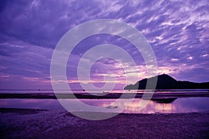 Boats in sunset after the mountain