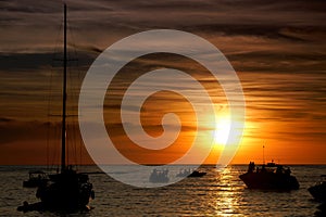 Boats in the sunset on Sunset Strip at Sant Antoni de Portmany, Ibiza, Spain photo