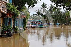 Boats on the Thu Bon River in Hoi An, Vietnam overflowed during the 2021 rainy season