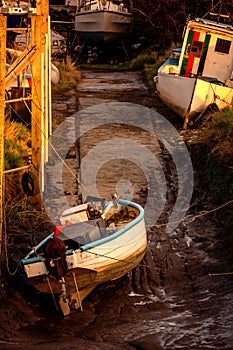 Boats in tidal inlet at Uphill Marina Weston Super Mare Somerset UK