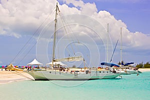 Boats at Turks and Caicos deserted beach photo