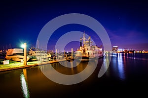 Boats on the waterfront at night, in Canton, Baltimore, Maryland