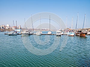 Boats and yachts anchored at the Tomis Turistic Port or harbor in Constanta photo