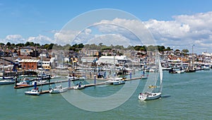 Boats and yachts Cowes harbour Isle of Wight with blue sky