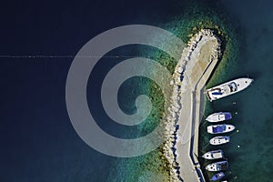 Boats and yachts dock on pier in holiday resort