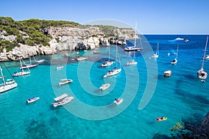 Boats and yachts on Macarella beach, Menorca, Spain photo