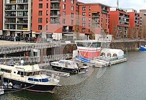 boats and yachts moored on banks Main river modern residential buildings, modern residential buildings german european city