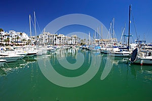 Boats and yachts moored in Duquesa port in Spain on the Costa de