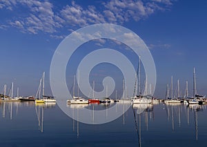 Boats and yachts moored at the port.