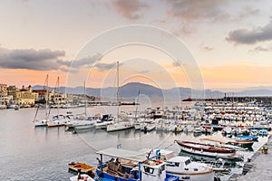 Boats and yatchs in the port of Torre del Greco in the gulf of Naples, on background Sorrento peninsula, Campania, Italy photo