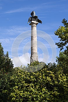 Boavista roundabout monument. Statue of a lion defeating an eagle. Trees around the monument. Blue sky photo