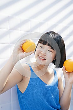 Bob hair girl in love with orange fruits