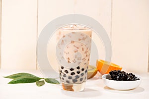 Boba / Bubble tea. Homemade Milk Tea with Pearls on wooden table