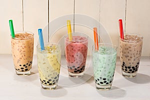 Boba / Bubble tea. Homemade Various Milk Tea with Pearls on wood