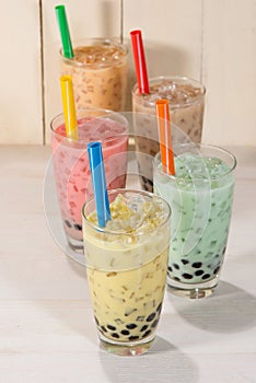 Boba / Bubble tea. Homemade Various Milk Tea with Pearls on wood