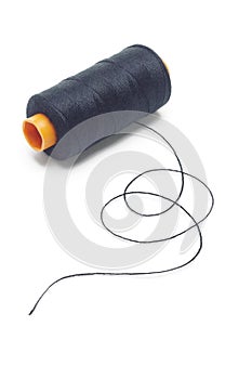 Bobbin of black cotton thread photo