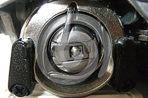 Bobbin case beneath the Sewing Machine