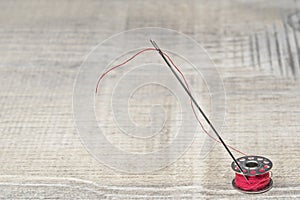 Bobbin needle and red thread
