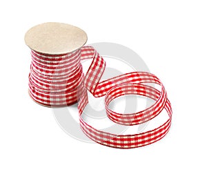 Bobbin with ribbon for scrapbooking on white background