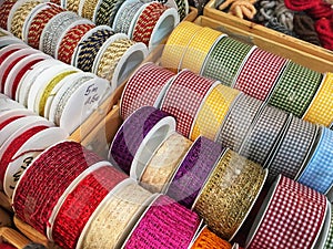 Bobbins with decorative ribbons for sewing, multicolored