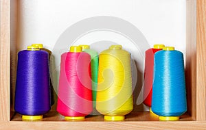 Bobbins of multicolored silk threads for embroidery and professional embroidery machines