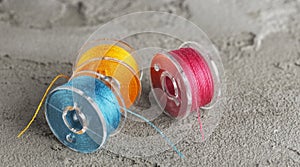 bobbins for a sewing machine with bright threads