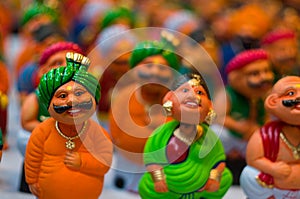 Bobble heads of indian men and women