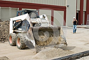 Bobcat Dumping Sand photo