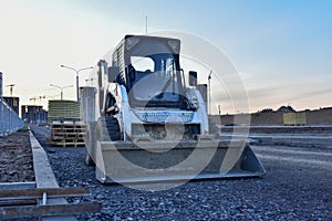Bobcat skid-steer loader for loading and unloading works on city streets. ÃÂ¡ompact construction equipment for work in limited