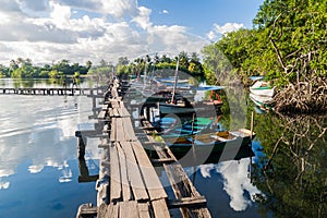 BOCA DE MIEL, CUBA - FEB 4, 2016: Fishing boats anchored at Rio Miel river mouth near Baracoa, Cu