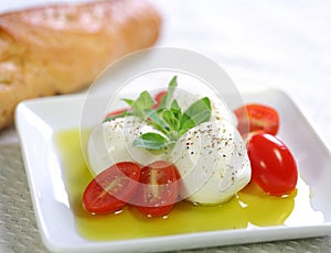 Bocconcini cheese, baby tomato and olive oil