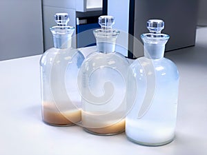 BOD bottle for analysis Biochemical Oxygen Demand in waste water sample, precipitation with solvent in flask.