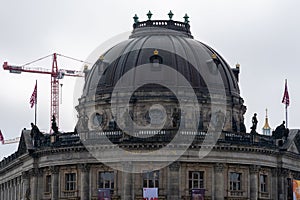 Bode Museum in Berlin, Germany with a crane doing construction beside it