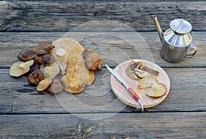 Bodegon made with thistle mushrooms on aged table III photo