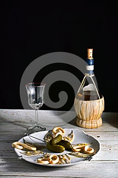 Bodegon with plate of anchovies in vinegar and wine photo