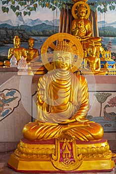 Bodhisattva and Buddha in back in Main Prayer Hall of Wang Saen Suk monastery, Bang Saen, Thailand