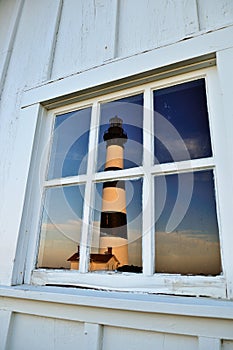 Bodie Lighthouse reflected in window