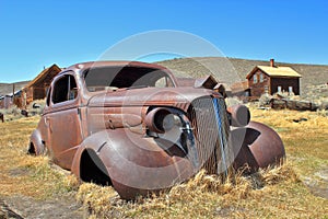 Bodie State Historic Site with Rusty Old Car in Desert Landscape, Eastern Sierra Nevada, California, USA