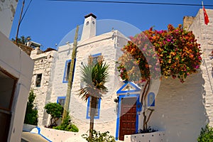 Traditional Bodrum White Houses in in Mediterranean Aegean Style - Wall with the Evil Eye Beads photo