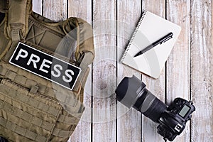 Body armor for journalist, notebook and camera photo