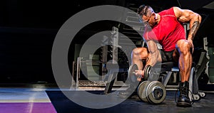 Body Builder Lifting Weights in The Gym, Performing Bicep Concentration Curls