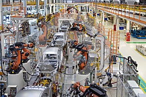 Body of car on conveyor top view. Modern Assembly of cars at the plant. The automated build process of the car body