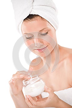Body care - beautiful woman apply moisturizer photo
