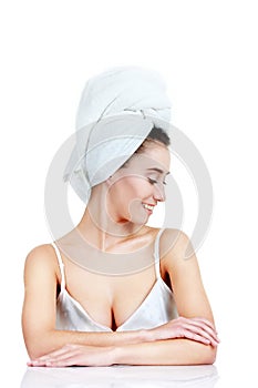 Body Care. Beautiful young woman posing in white towel. Spa, hea