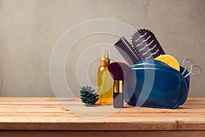 Body care and beauty products on wooden table over gray background