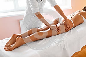Body care. Legs massage in spa salon