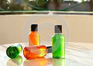 Body care products. Cosmetic bottles mock ups with shower gel, body moisturizing lotion or herbal shampoo on bath towel background