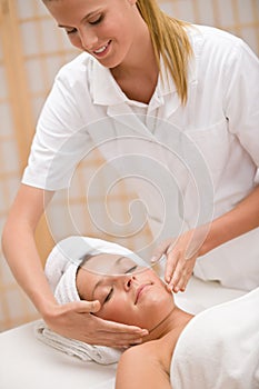 Body care - woman at face massage